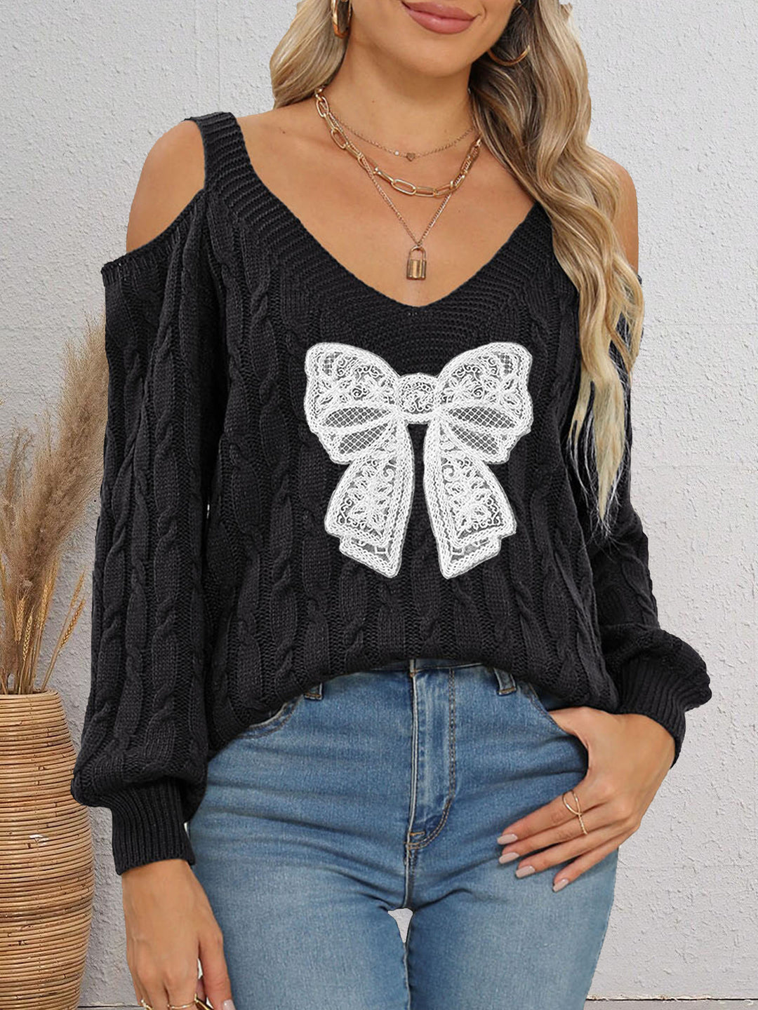 Damen modischer Pullover mit verspielt eingestricktem Schleifenmotiv EB
