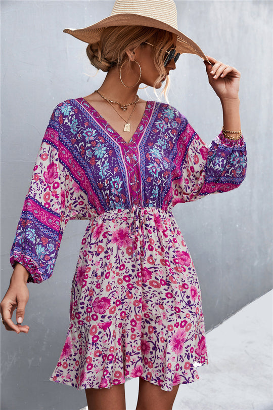 Damen Sommerliches Blusenkleid mit auffälligem floralen Muster und eleganten Puffärmeln EB