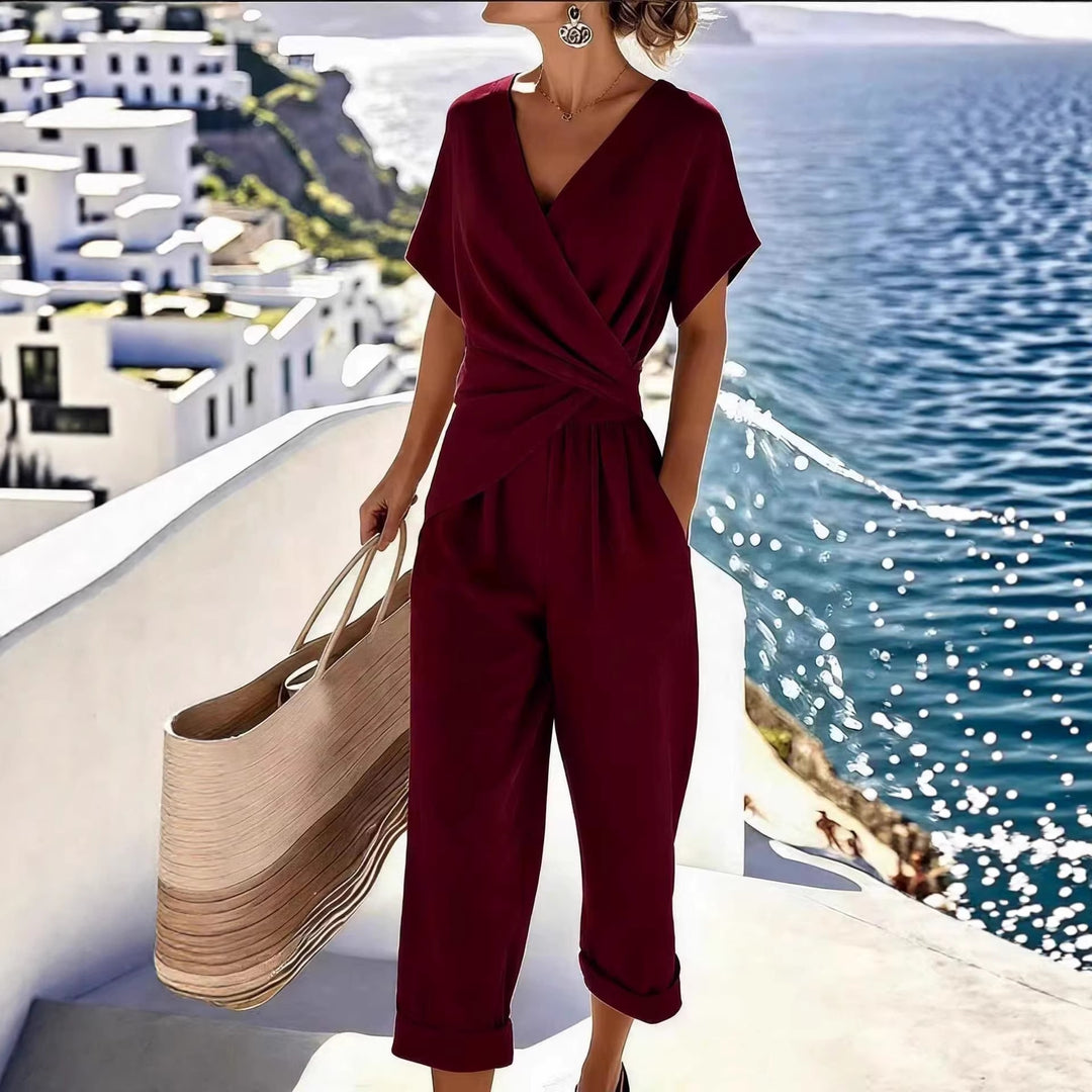 Damen Eleganter Jumpsuit mit Wickeloptik und breiten Beinen EB