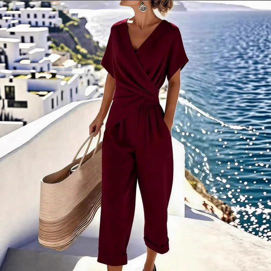 Damen Eleganter Jumpsuit mit Wickeloptik und breiten Beinen EB