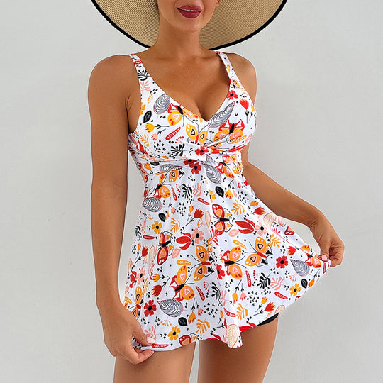 Damen Sportlicher Badeanzug mit fließendem Rock und floralen Akzenten EB