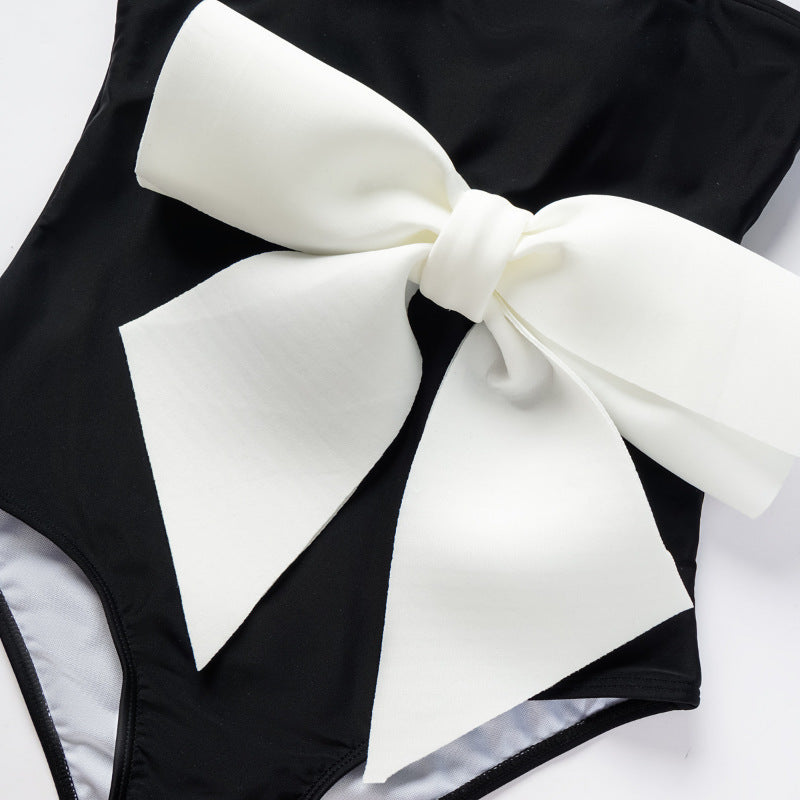 Damen Einteiler Badeanzug mit eleganter Schleifenapplikation EB