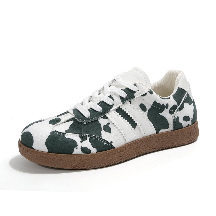 Damen Sportliche Sneakers mit trendigem Kuhdesign EB