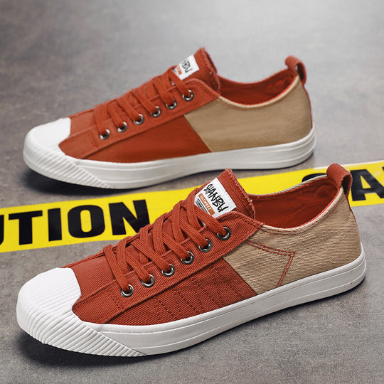 Unisex niedrige Canvas-Sneaker mit verstärkter Gummi-Zehenkappe und kontrastierenden Textilpaneelen EB