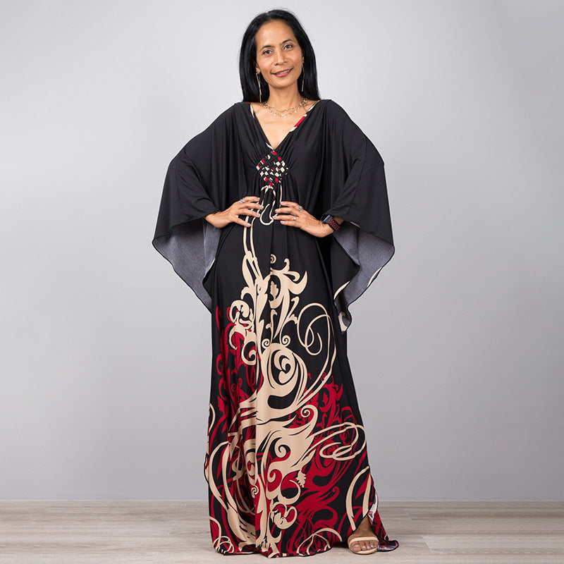 Damen Maxikleid mit kunstvollem Pfauenmuster und seitlichen Schlitzen Heidi Mode