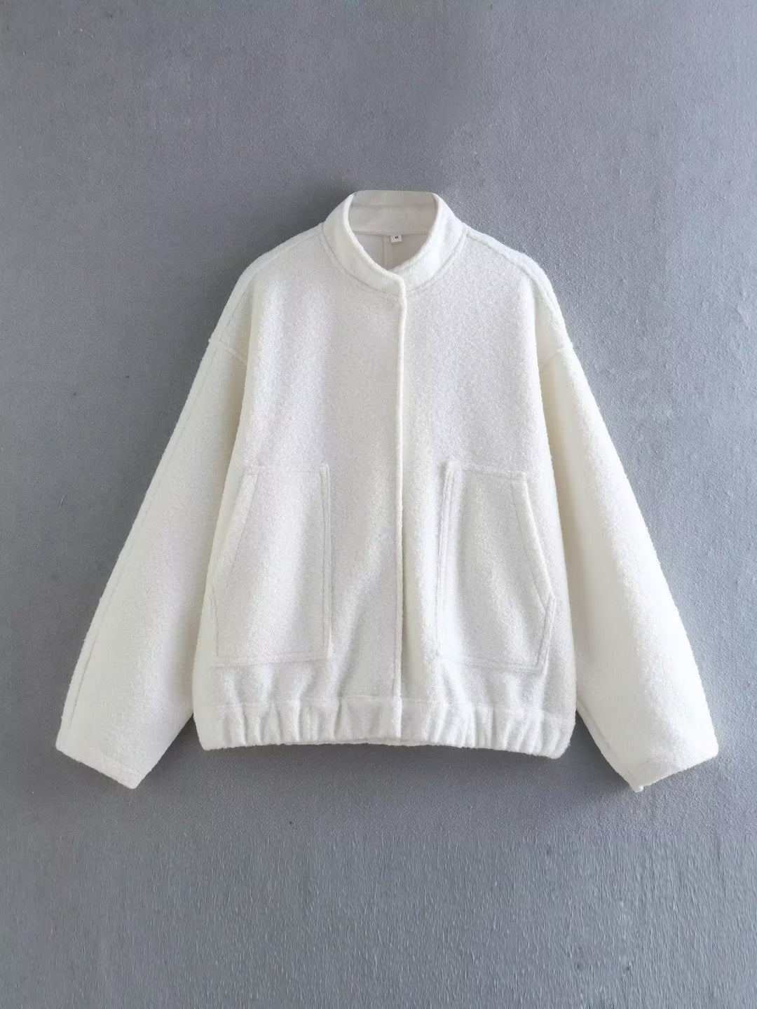 Damen Oversized Strickjacke aus weichem Teddystoff mit Stehkragen und seitlichen Taschen EB