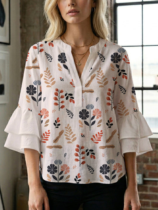 Damen Bluse mit voluminösen Rüschenärmeln und modernem Motiv EB