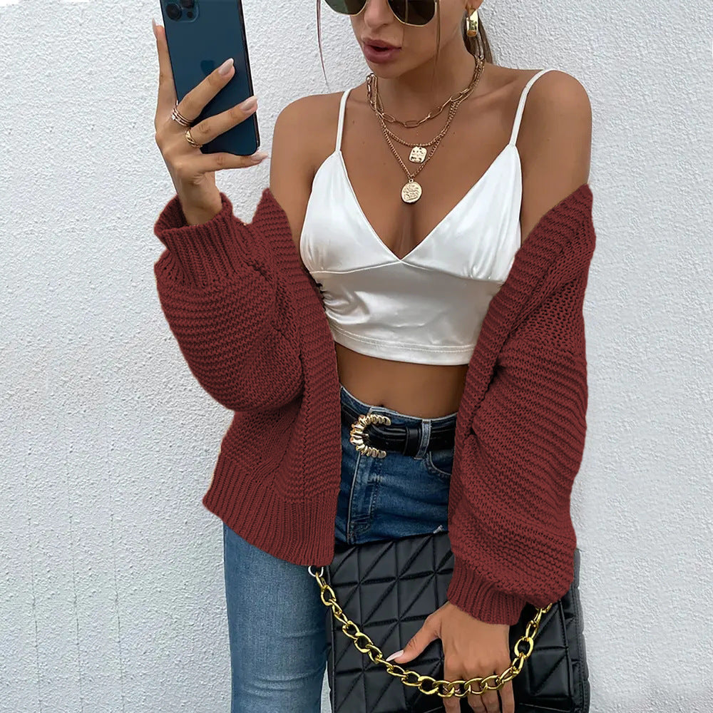 Damen Strickjacke mit voluminösen Ärmel und stylischem Rippenmuster EB