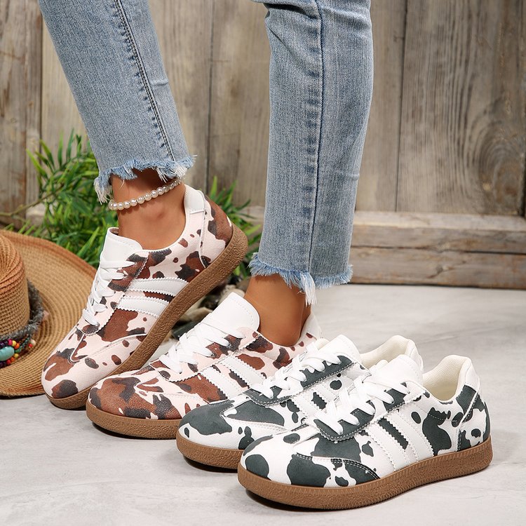 Damen Sportliche Sneakers mit trendigem Kuhdesign EB