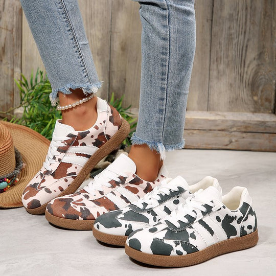 Damen Sportliche Sneakers mit trendigem Kuhdesign EB