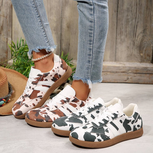 Damen Sportliche Sneakers mit trendigem Kuhdesign EB