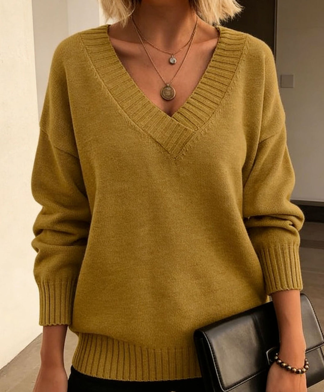 Damen Feinstrickpullover mit tiefem V-Ausschnitt und überschnittener Schulter EB