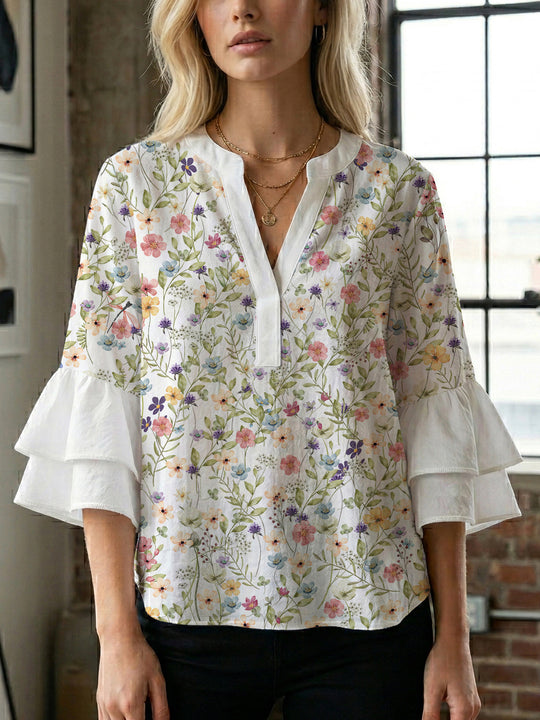 Damen Bluse mit voluminösen Ärmeln und floralem Design EB