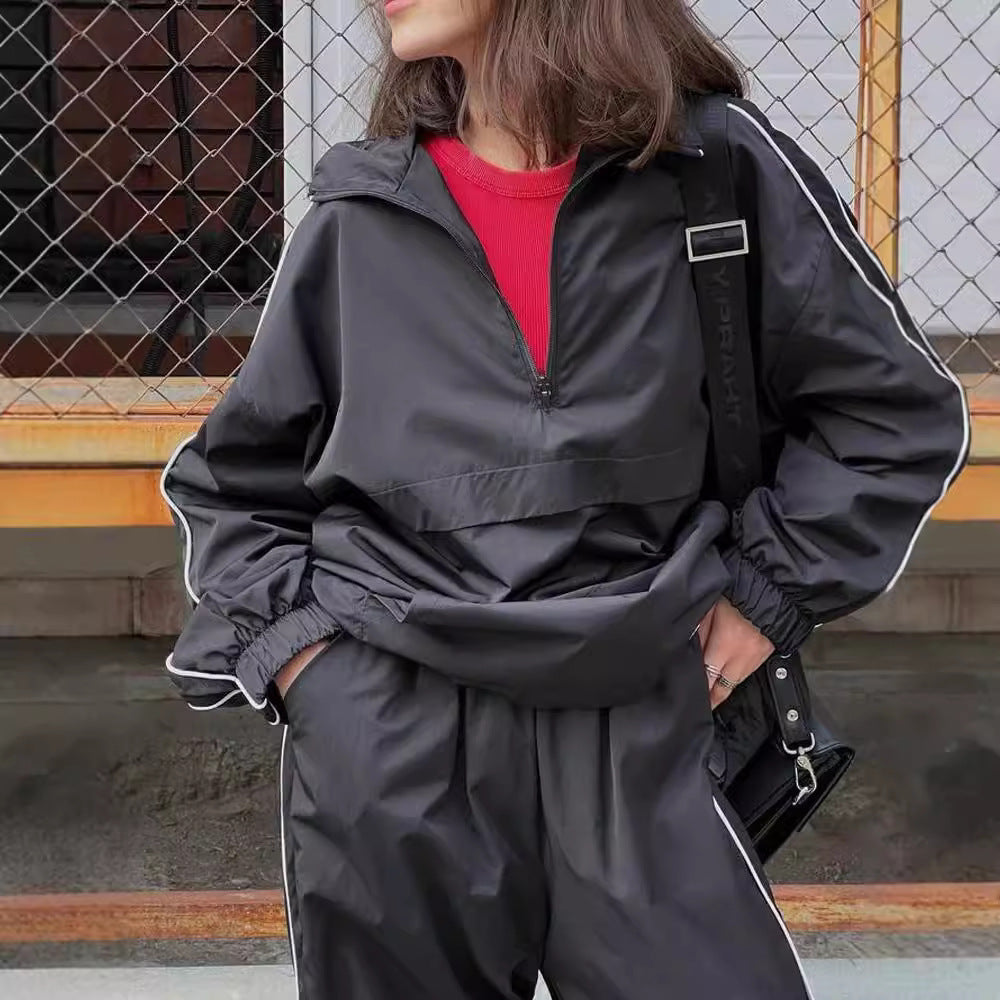Damen winddichter Crop-Halfzip-Trainingsanzug mit elastischem Bund und kontrastierender Paspel Eichborn Berlin