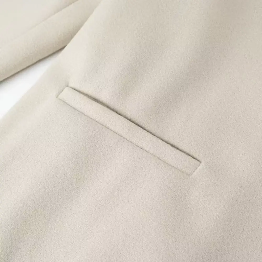 EB | Quasten Blends Mantel
