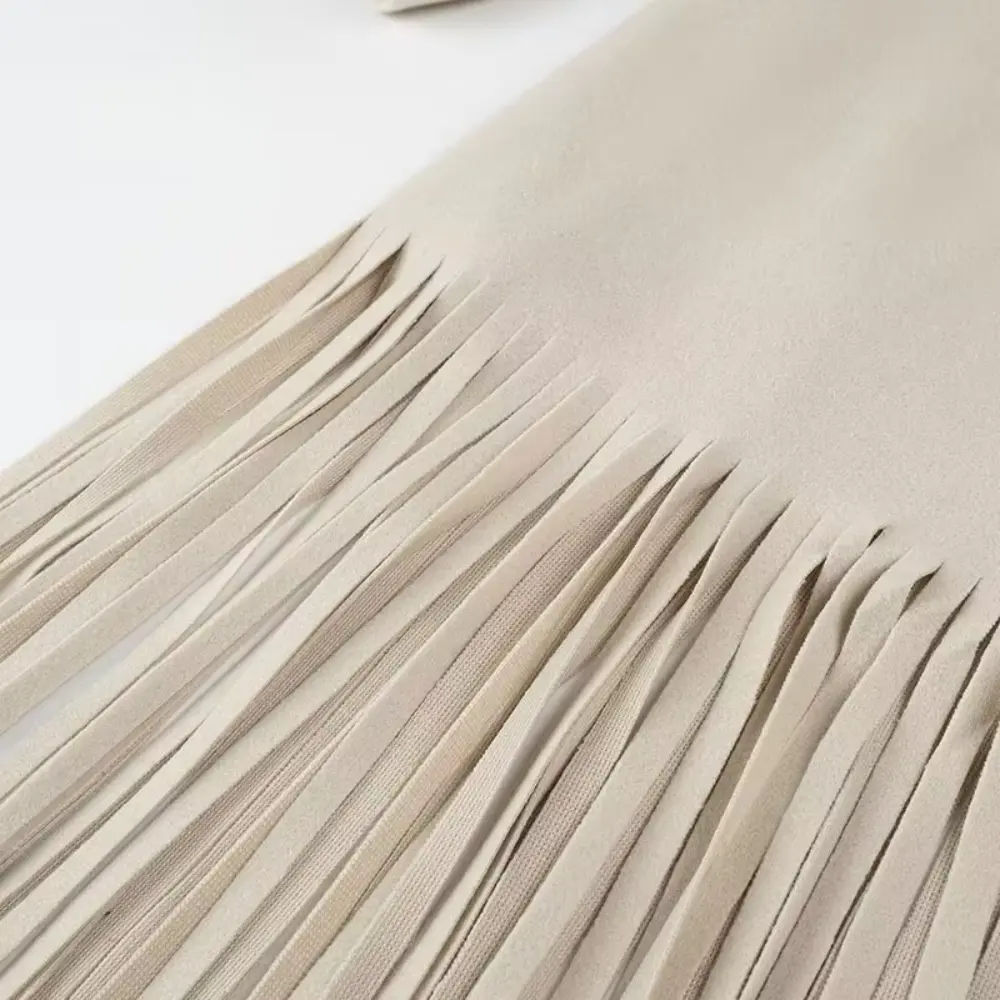 EB | Quasten Blends Mantel